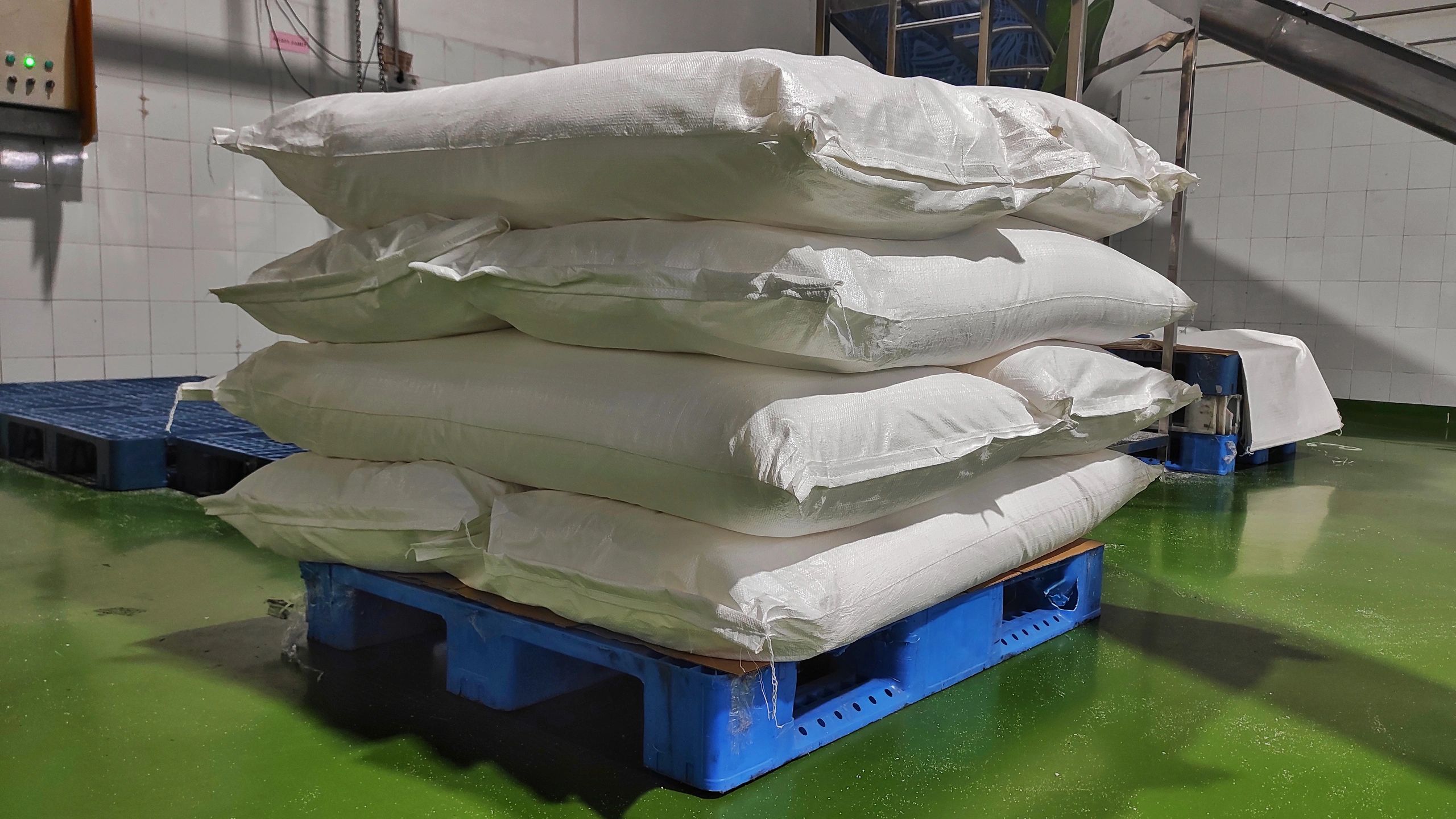 Bagged material stacked in an industrial setting